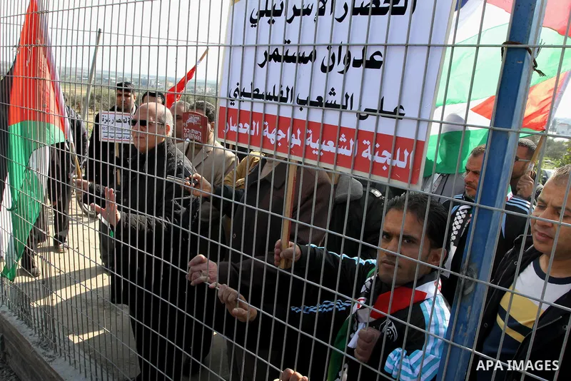 Palestinians take part in a protest against the Israeli blockade on Gaza, at Erez crossing between Israel and Gaza Strip Feb. 06, 2014. Israel imposed a blockade on Gaza in 2007 after Islamist group Hamas seized control...