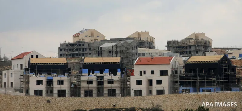 Construction laborers work at the site of a new housing unit in the Settlement of Vrata, southern the West Bank City of Bethlehem, Feb. 06, 2014. Israeli officials have given final approval for 558 new apartments in Jewi...