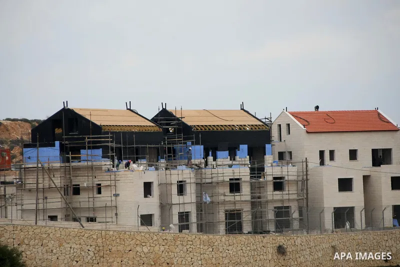 Construction laborers work at the site of a new housing unit in the Settlement of Vrata, southern the West Bank City of Bethlehem, Feb. 06, 2014. Israeli officials have given final approval for 558 new apartments in Jewi...