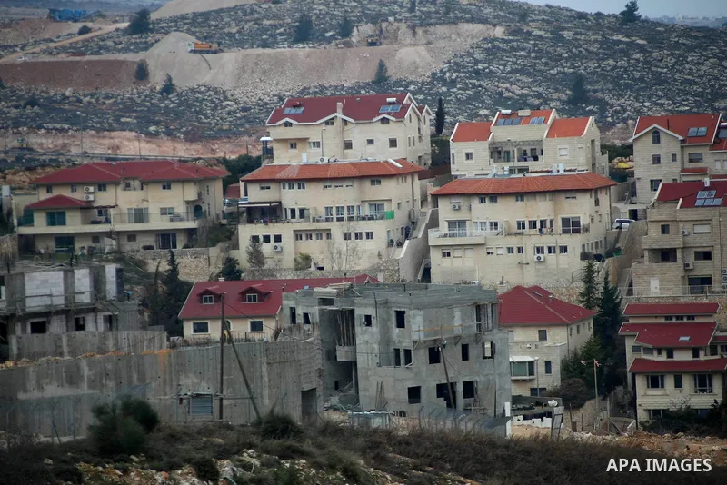 Construction laborers work at the site of a new housing unit in the Settlement of Vrata, southern the West Bank City of Bethlehem, Feb. 06, 2014. Israeli officials have given final approval for 558 new apartments in Jewi...