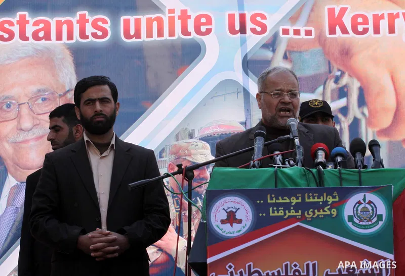 Palestinian Jihad Islamic leader, Khader Habeeb takes part in a protest in the Jebaliya refugee camp, the northern Gaza Strip, Friday, Feb. 7, 2014. Palestinian Hamas and Islamic Jihad supporters chanted slogans against...