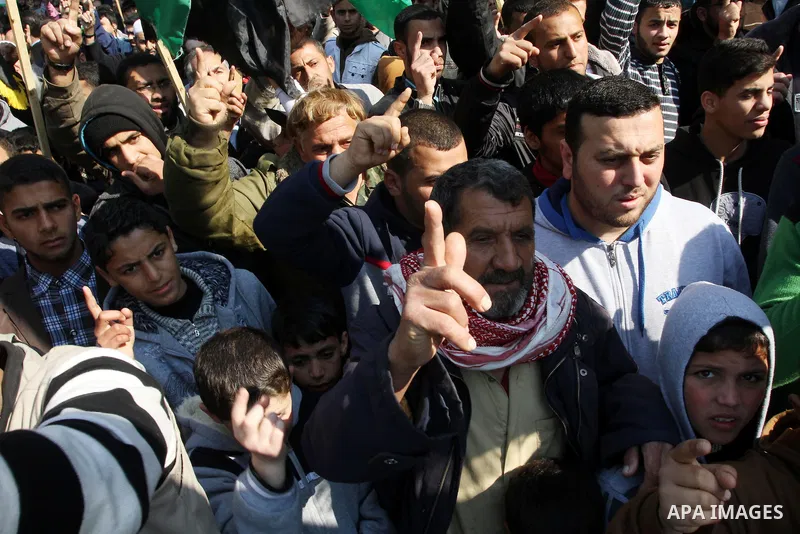 Palestinian Hamas and Islamic Jihad supporters take part in a protest in the Jebaliya refugee camp, the northern Gaza Strip, Friday, Feb. 7, 2014. The protesters chanted slogans against the peace talks with Israel. Photo...