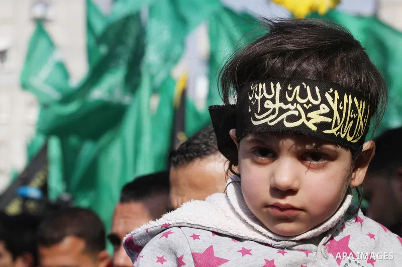 Palestinian Hamas and Islamic Jihad supporters take part in a protest in the Jebaliya refugee camp, the northern Gaza Strip, Friday, Feb. 7, 2014. The protesters chanted slogans against the peace talks with Israel. Photo...