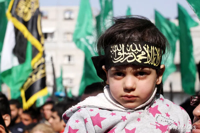 Palestinian Hamas and Islamic Jihad supporters take part in a protest in the Jebaliya refugee camp, the northern Gaza Strip, Friday, Feb. 7, 2014. The protesters chanted slogans against the peace talks with Israel. Photo...
