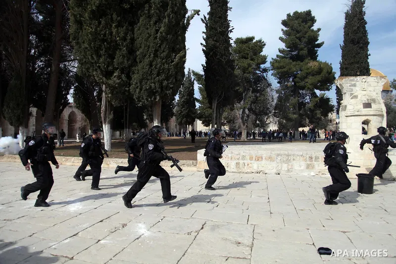Israeli policemen run in front of the Dome of the Rock during clashes with stone-throwing Palestinians after Friday prayers on the compound known to Muslims as Noble Sanctuary and to Jews as Temple Mount in Jerusalem's O...