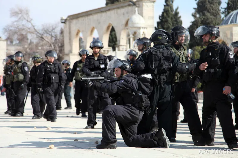 Israeli policeman aims his rubber bullet launcher during clashes with stone-throwing Palestinians after Friday prayers on the compound known to Muslims as Noble Sanctuary and to Jews as Temple Mount in Jerusalem's Old Ci...
