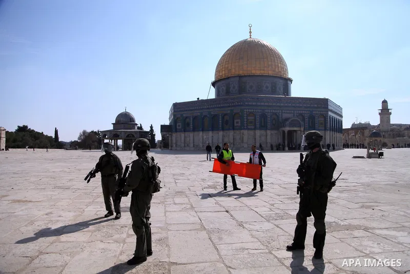 Israeli policemen stand in front of the Dome of the Rock during clashes with stone-throwing Palestinians after Friday prayers on the compound known to Muslims as Noble Sanctuary and to Jews as Temple Mount in Jerusalem's...