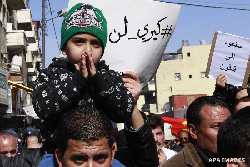 Jordanian activists take part in a demonstration against US Secretary of State John Kerry and his peace proposal, in Amman on February 7, 2014. Kerry is pressing Israel and the Palestinians to agree on a framework to gui...