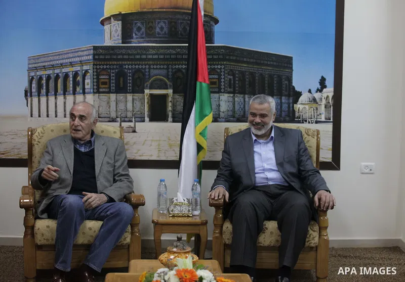 Palestinian Prime Minister in Gaza strip Ismail Haniyeh meets with businessman Munib al-Masri in Gaza city on Feb. 08, 2014. Photo by Ashraf Amra