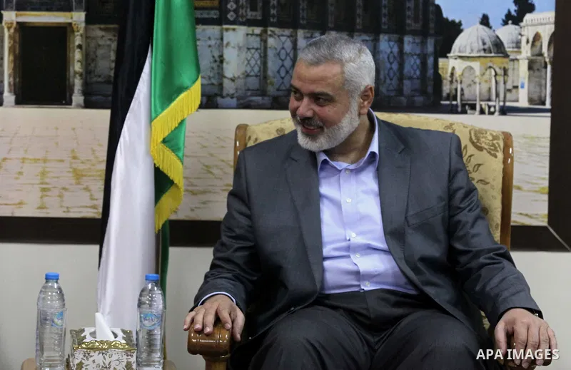 Palestinian Prime Minister in Gaza strip Ismail Haniyeh meets with businessman Munib al-Masri in Gaza city on Feb. 08, 2014. Photo by Ashraf Amra