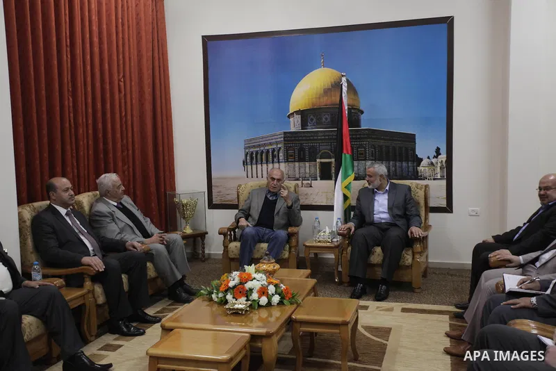 Palestinian Prime Minister in Gaza strip Ismail Haniyeh meets with businessman Munib al-Masri in Gaza city on Feb. 08, 2014. Photo by Ashraf Amra