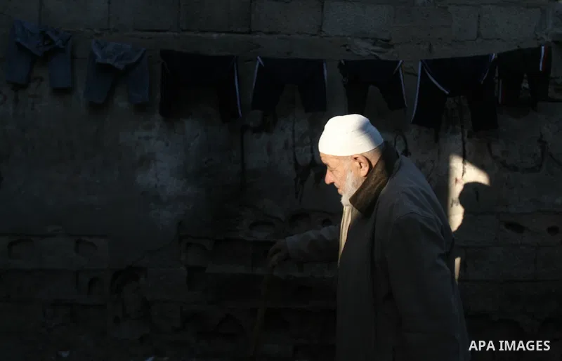 A Palestinian man walks at a street in Rafah refugee camp in the southern Gaza Strip, February 08, 2014. Photo by Eyad Al Baba