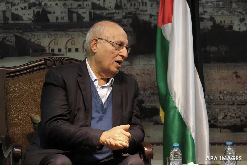 The member of Fatah Central Committee Nabil Shaath speaks with Palestinian Prime Minister in Gaza Strip Ismail Haniyeh (not pictured) during a meeting at Haniyeh's home in Gaza City on February 09, 2014. In a brief state...
