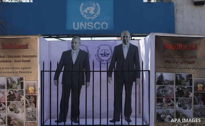 A General show of the images of the war criminals Prime Minister of Israel Benjamin Netanyahu, and former Prime Minister Ehud Barak during a moot court for them, in front of the headquarters of the United States, in Gaza...