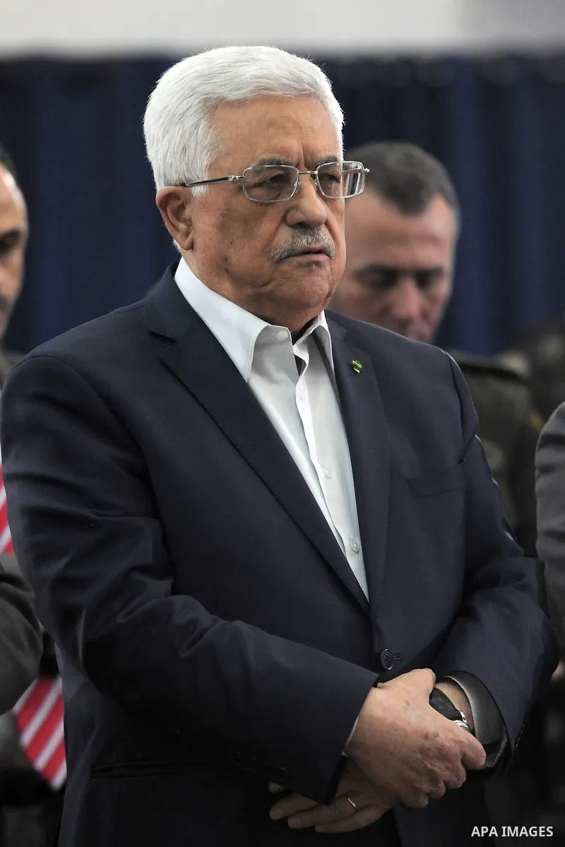 Palestinian President Mahmud Abbas performs a prayer for rain among Muslim worshippers on February 10, 2014 at a mosque in the West Bank city of Ramallah. Photo by Thaer Ganaim