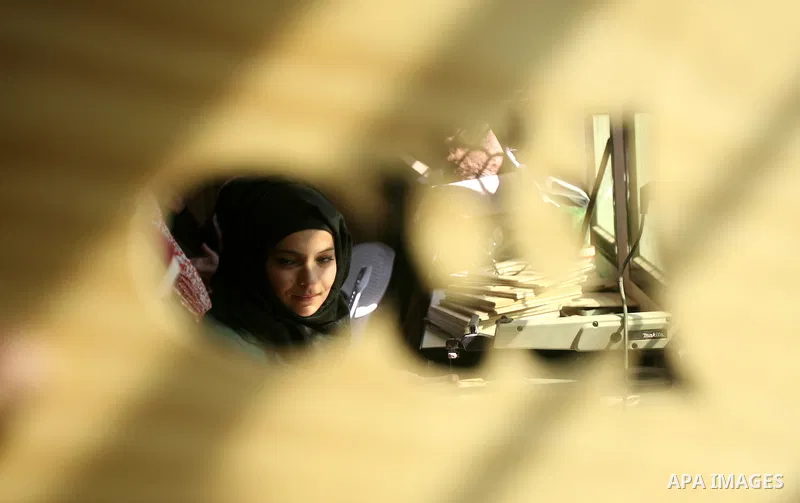 Deaf Palestinian women work on embroidery at al-Amal rehabilitation society, in Rafah in the southern Gaza Strip, February 10, 2014. The society aims to aims to create a social qualitative gathering for deaf to support t...