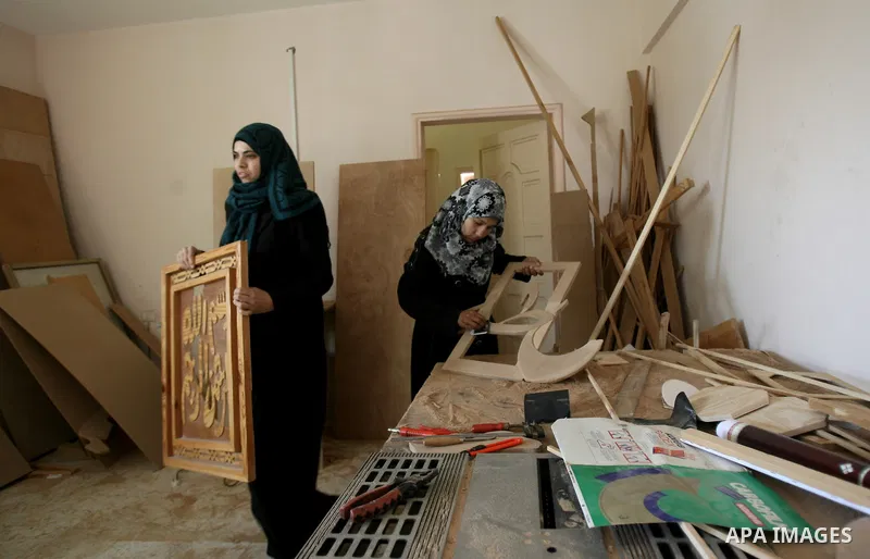 Deaf Palestinian women work in a carpentry workshop at al-Amal rehabilitation society, in Rafah in the southern Gaza Strip, February 10, 2014. The society aims to aims to create a social qualitative gathering for deaf to...