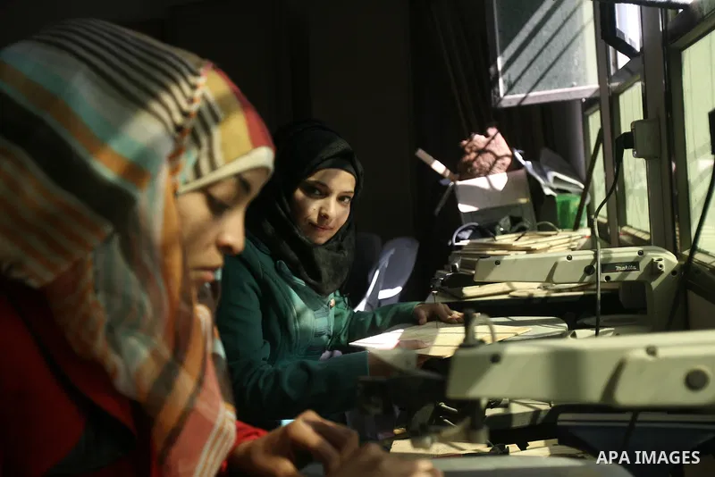 Deaf Palestinian women work on embroidery at al-Amal rehabilitation society, in Rafah in the southern Gaza Strip, February 10, 2014. The society aims to aims to create a social qualitative gathering for deaf to support t...