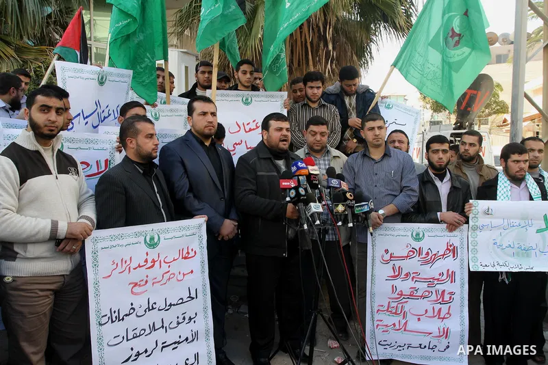 Palestinian members of the Islamic bloc take part in a protest against political arrests in the West Bank, Gaza City, on February 11, 2014. Photo by Mohammed Asad