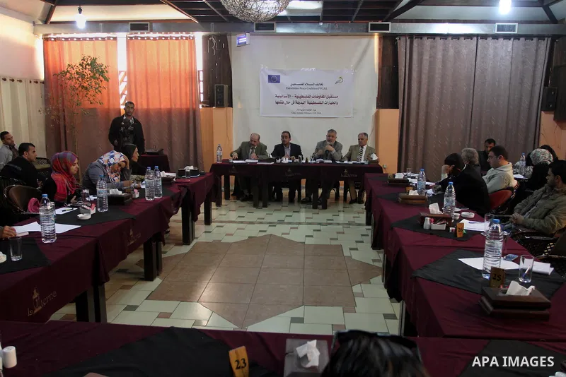 Palestinians take part in a workshop about political developments, Gaza City, on February 11, 2014. Photo by Mohammed Asad