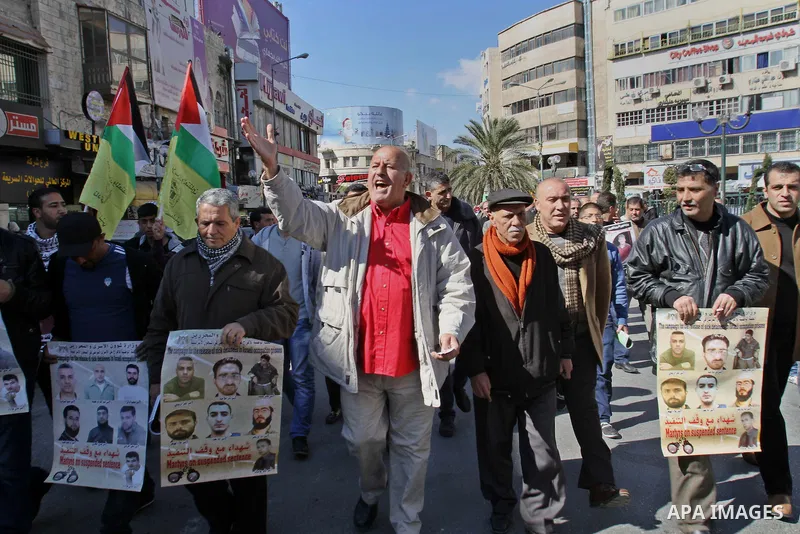 Palestinians take part in a protest demanding the release of their relatives prisoners held in Israeli jails, in the west Bank city of Nablus, on Feb. 11, 2014. Photo by Nedal Eshtayah