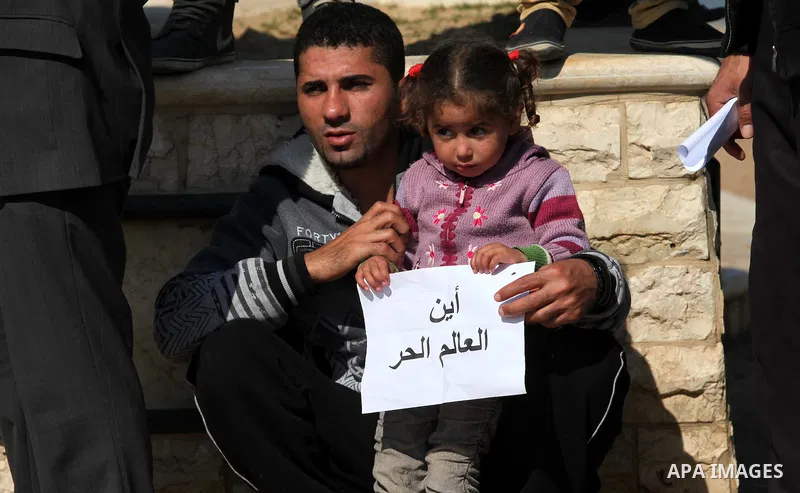 Palestinian fishermen hold banners during a protest against the blockade on Gaza Strip, at the seaport of Gaza City Feb. 12, 2014. Israel imposed a blockade on Gaza in 2007 after its enemy, Islamist group Hamas, seized c...