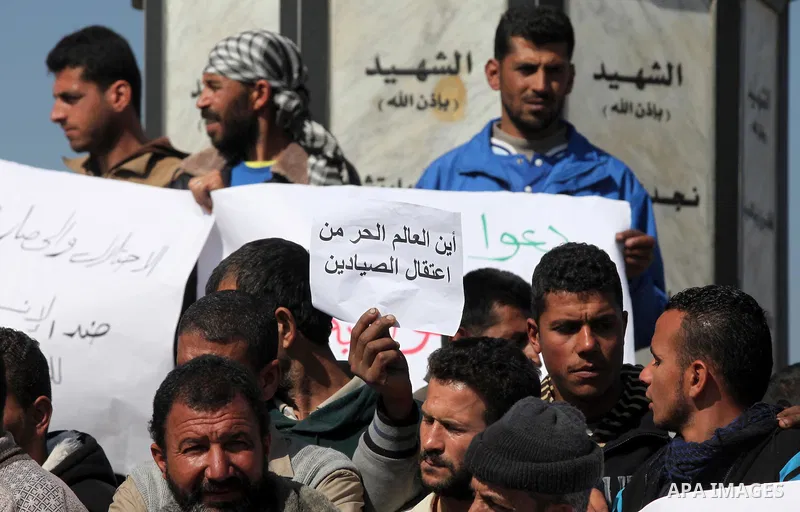 Palestinian fishermen hold banners during a protest against the blockade on Gaza Strip, at the seaport of Gaza City Feb. 12, 2014. Israel imposed a blockade on Gaza in 2007 after its enemy, Islamist group Hamas, seized c...