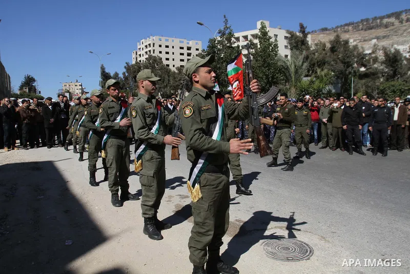 Palestinians carry the coffin of Habash Hanani, killed in 2002, during his funeral in the West Bank city of Nablus. Wednesday, Feb. 12, 2014. Israel started transferring the bodies of 36 Palestinians killed in attacks on...
