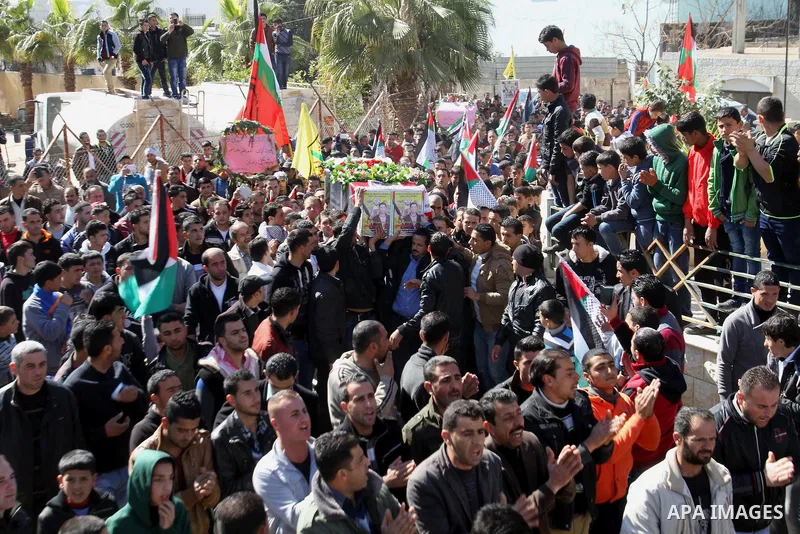 Palestinians carry the coffin of Habash Hanani, killed in 2002, during his funeral in the West Bank city of Nablus. Wednesday, Feb. 12, 2014. Israel started transferring the bodies of 36 Palestinians killed in attacks on...