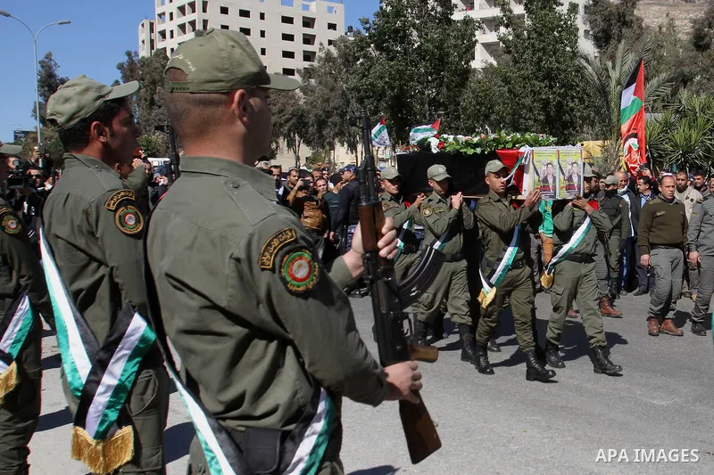 Palestinians carry the coffin of Habash Hanani, killed in 2002, during his funeral in the West Bank city of Nablus. Wednesday, Feb. 12, 2014. Israel started transferring the bodies of 36 Palestinians killed in attacks on...