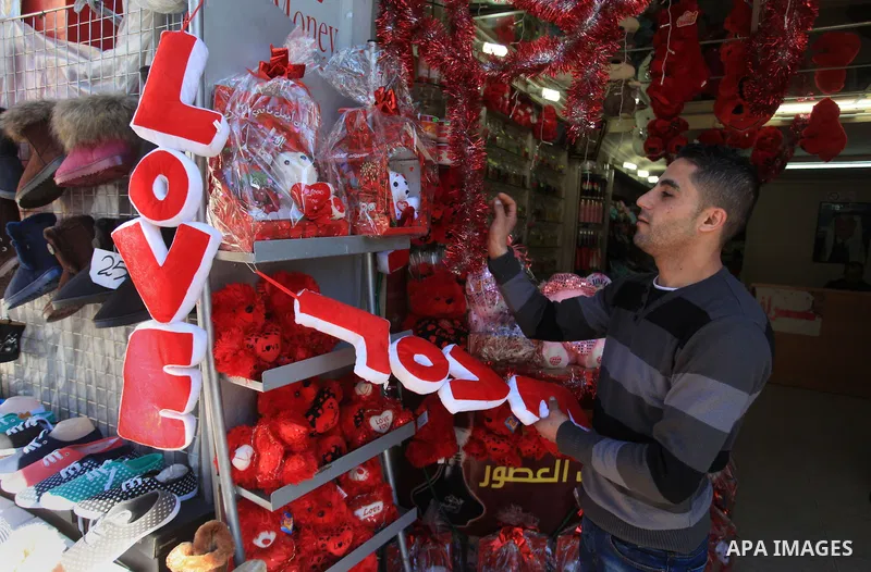 A Palestinian vendor displays gifts at his store ahead of Valentine's day in the West Bank City of Ramallah on February 12, 2014. Valentine's Day is increasingly popular among younger Palestinians, many of whom have take...
