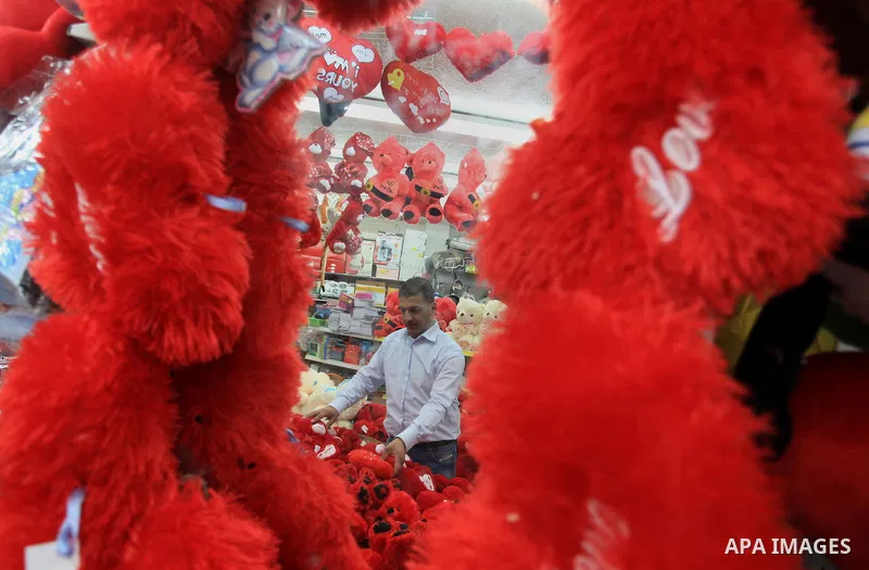 A Palestinian vendor displays gifts at his store ahead of Valentine's day in the West Bank City of Ramallah on February 12, 2014. Valentine's Day is increasingly popular among younger Palestinians, many of whom have take...