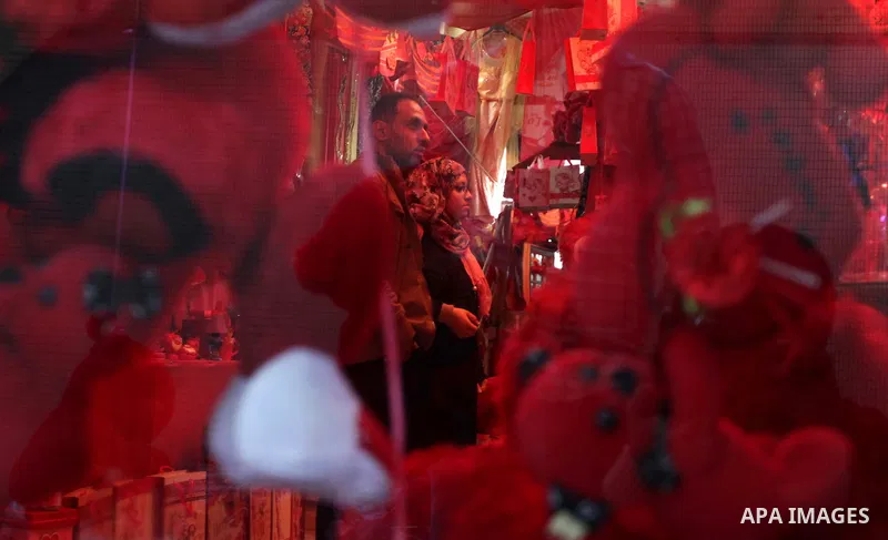 Palestinians shop for gifts ahead of Valentine's day in Gaza City on February 12, 2014. Valentine's Day is increasingly popular among younger Palestinians, many of whom have taken up the custom of giving cards, chocolate...