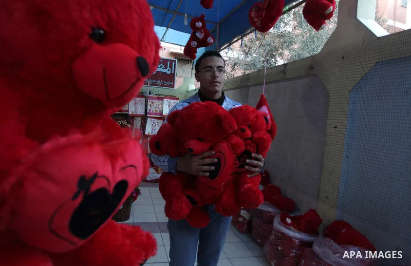 A Palestinian vendor displays gifts at his store ahead of Valentine's day in Gaza City on February 12, 2014. Valentine's Day is increasingly popular among younger Palestinians, many of whom have taken up the custom of gi...