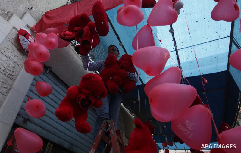 A Palestinian vendor displays gifts at his store ahead of Valentine's day in Gaza City on February 12, 2014. Valentine's Day is increasingly popular among younger Palestinians, many of whom have taken up the custom of gi...
