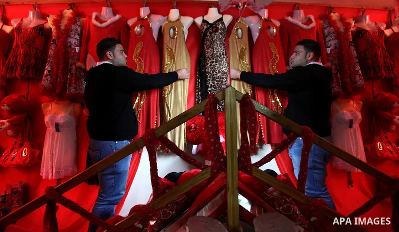 A Palestinian vendor displays gifts at his store ahead of Valentine's day in Gaza City on February 12, 2014. Valentine's Day is increasingly popular among younger Palestinians, many of whom have taken up the custom of gi...