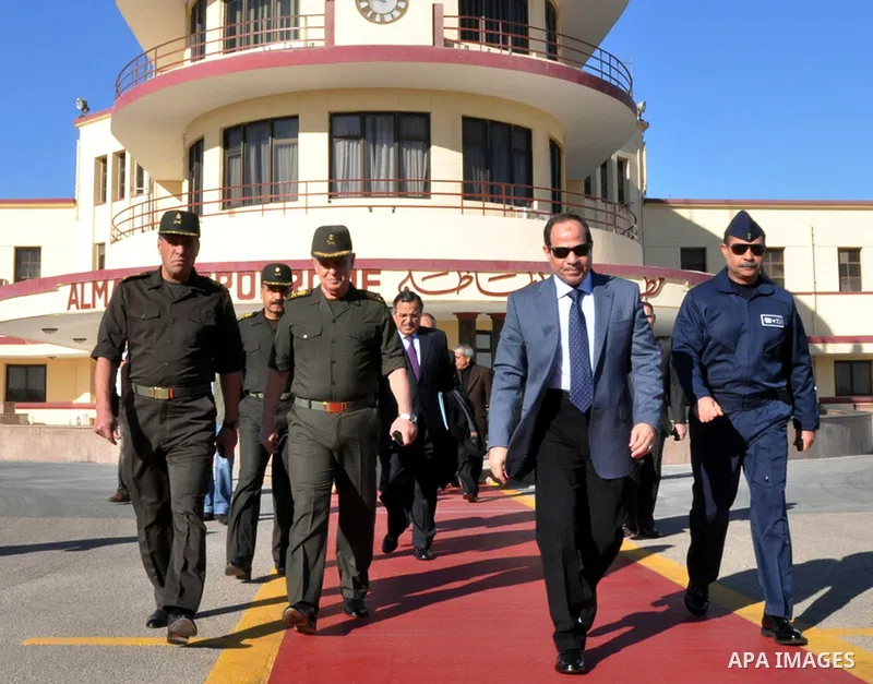 Egypt's Army Chief Field Marshal Abdel Fattah al-Sisi (2nd R) walks with military generals at Al Mazaa military airport in Cairo, before travelling to Russia, in this undated handout photo released on February 12, 2014 b...