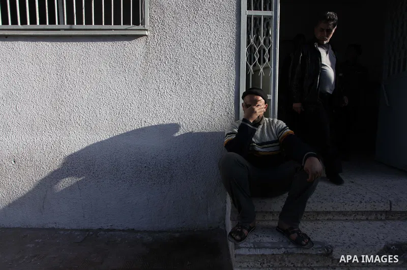A Palestinian relative of Ibrahim Suleiman Mansour, 26, reacts after he dead by Israeli security forces at a hospital in Gaza City on February 13, 2014. A Palestinian man was moderately injured Thursday and another died...