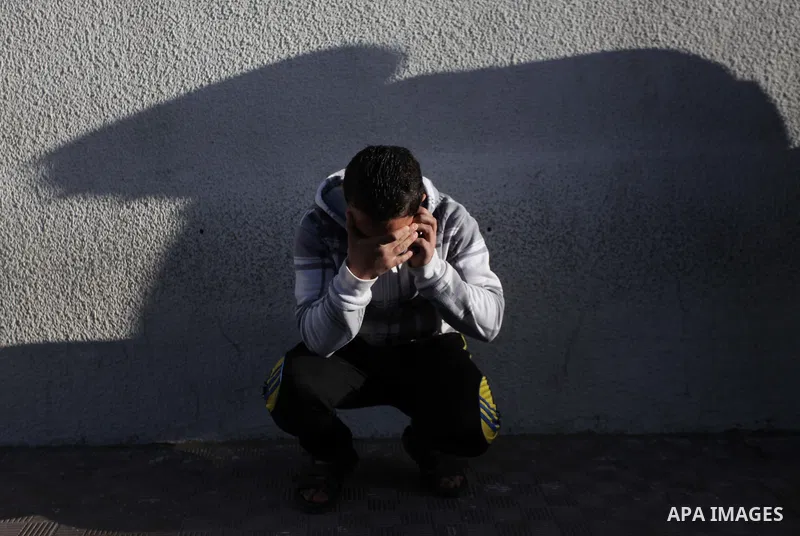 A Palestinian relative of Ibrahim Suleiman Mansour, 26, reacts after he dead by Israeli security forces at a hospital in Gaza City on February 13, 2014. A Palestinian man was moderately injured Thursday and another died...