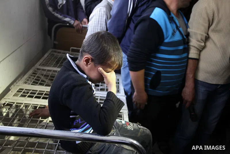 A Palestinian relative of Ibrahim Suleiman Mansour, 26, reacts after he dead by Israeli security forces at a hospital in Gaza City on February 13, 2014. A Palestinian man was moderately injured Thursday and another died...
