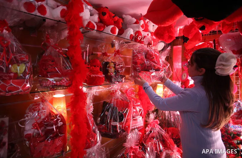 A Palestinian vendor displays gift at his store ahead of Valentine's day in Jerusalem on February 13, 2014. Valentine's Day is increasingly popular among younger Palestinians, many of whom have taken up the custom of giv...