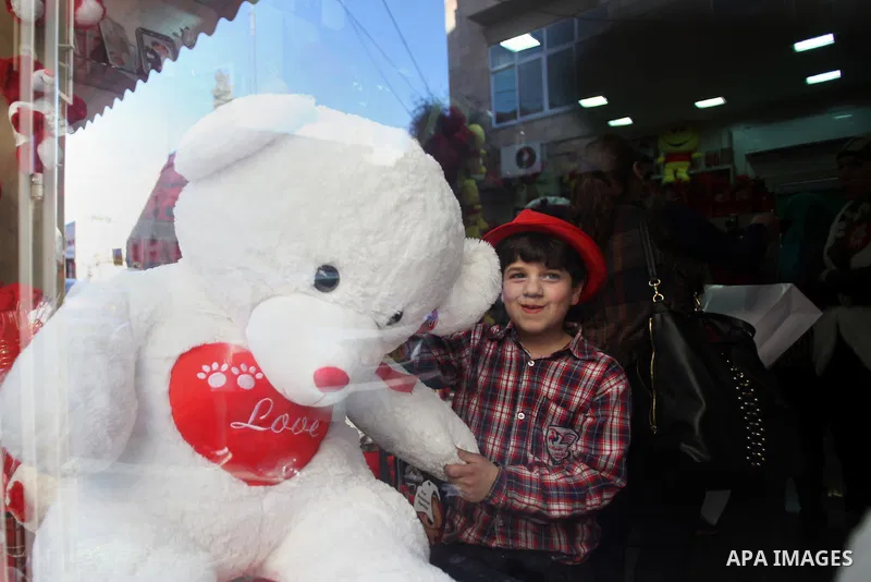 A Palestinian boy holds a teddy bear at a gift store ahead of Valentine's day in Jerusalem on February 13, 2014. Valentine's Day is increasingly popular among younger Palestinians, many of whom have taken up the custom o...