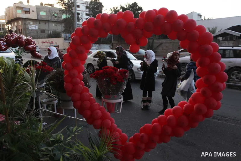 Palestinian girls shop for gifts ahead of Valentine's day in Gaza City on February 13, 2014. Valentine's Day is increasingly popular among younger Palestinians, many of whom have taken up the custom of giving cards, choc...