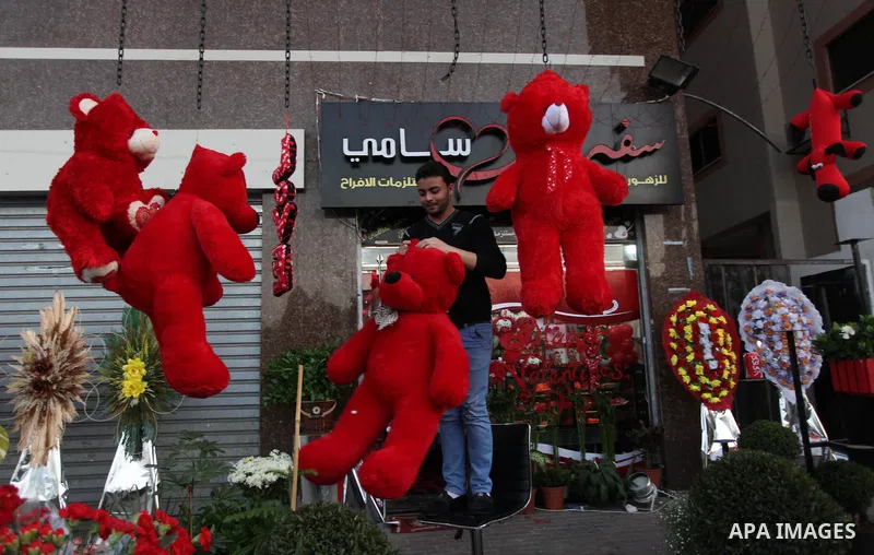 A Palestinian vendor displays gifts at his store ahead of Valentine's day in Gaza City on February 13, 2014. Valentine's Day is increasingly popular among younger Palestinians, many of whom have taken up the custom of gi...
