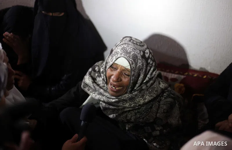 The Palestinian mother of Ibrahim Mansour, 26, who was killed by Israeli soldiers, mourns during his funeral in Gaza City February 14, 2014. Israeli soldiers shot and killed Mansour and wounded another on Thursday in the...