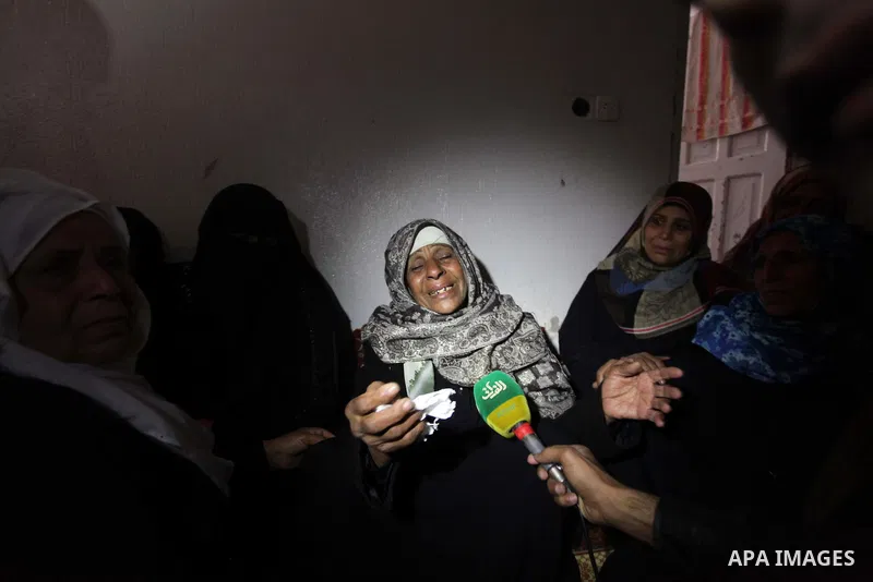 The Palestinian mother of Ibrahim Mansour, 26, who was killed by Israeli soldiers, mourns during his funeral in Gaza City February 14, 2014. Israeli soldiers shot and killed Mansour and wounded another on Thursday in the...