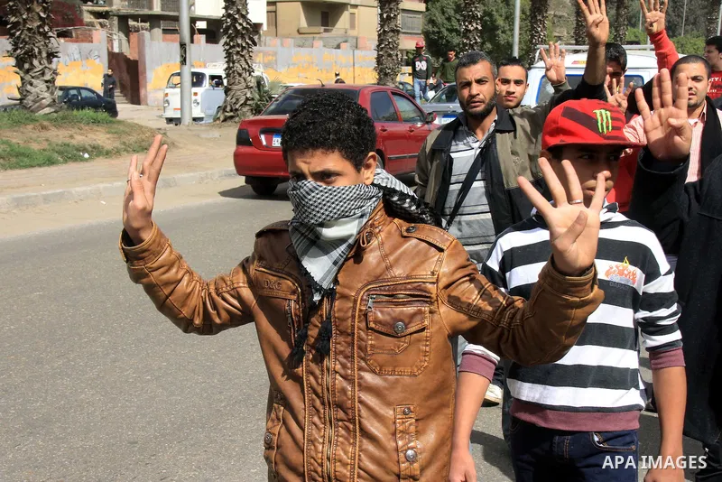 Egyptian protesters shout slogans during a demonstration in support of Egypt's ousted President Mohammed Morsi, in Cairo on Feb. 14, 2014. Photo by Mohammed Bendari