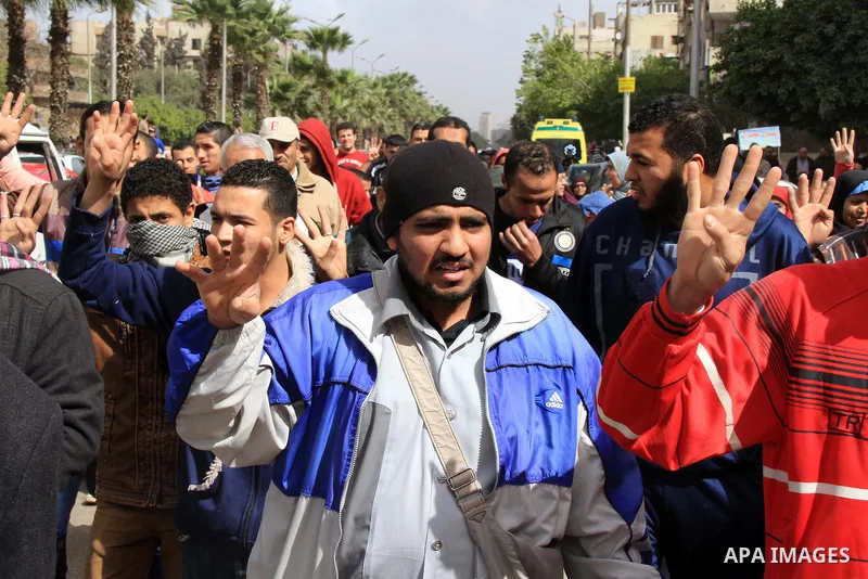 Egyptian protesters shout slogans during a demonstration in support of Egypt's ousted President Mohammed Morsi, in Cairo on Feb. 14, 2014. Photo by Mohammed Bendari