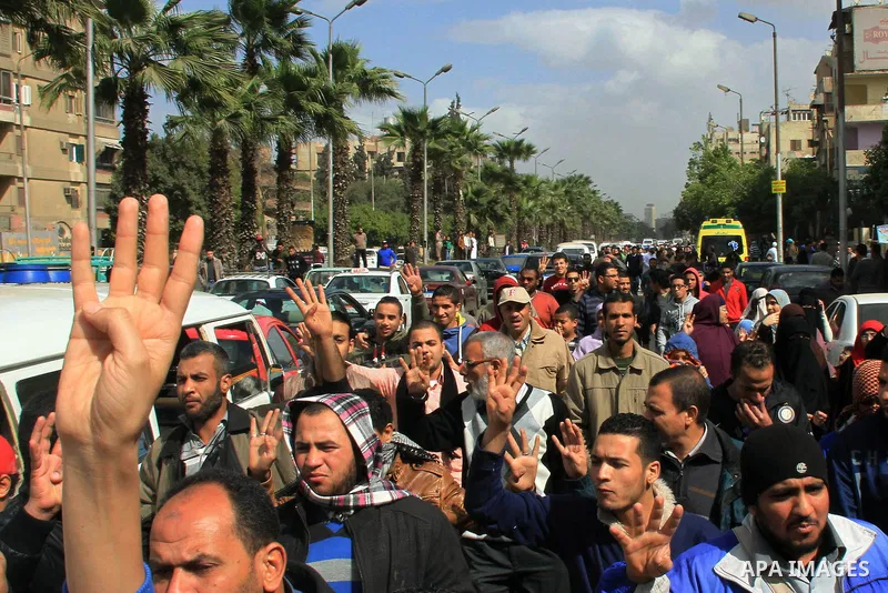 Egyptian protesters shout slogans during a demonstration in support of Egypt's ousted President Mohammed Morsi, in Cairo on Feb. 14, 2014. Photo by Mohammed Bendari