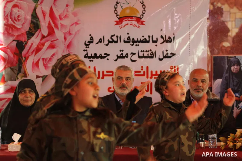 Palestinian Prime Minister in Gaza strip, Ismail Haniyeh attends the opening of ceremony of freed Palestinian female prisoners association, in Gaza city, on Feb. 15, 2014. Photo by Mohammed Asad